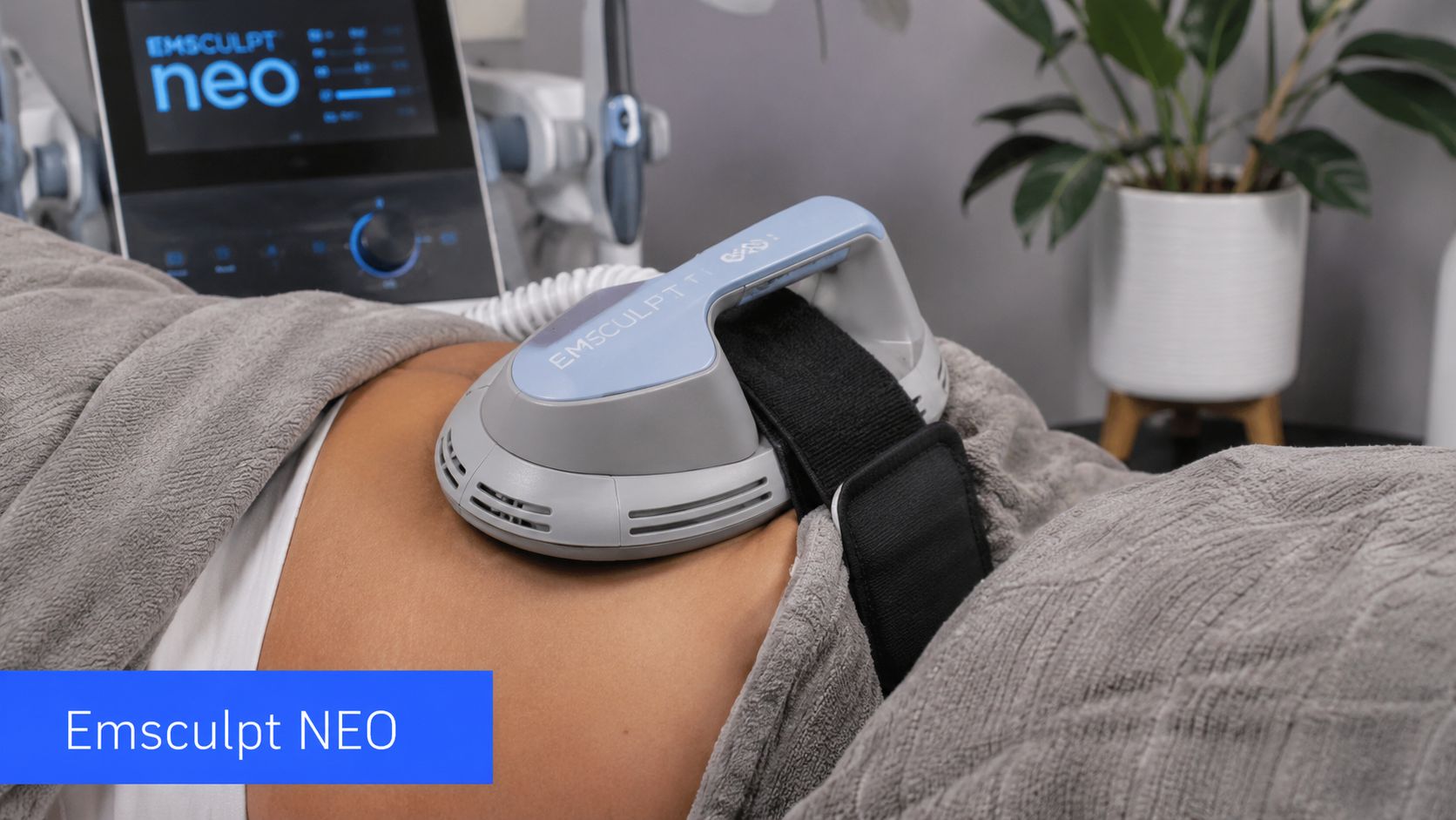 A person receiving a non-surgical body contouring treatment on their abdomen using an Emsculpt NEO device.